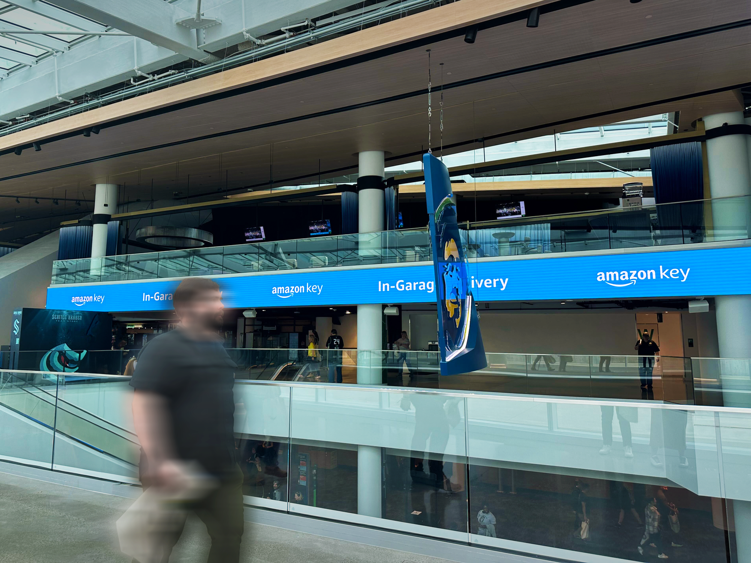 Amazon Key In-Garage Delivery signage along the Climate Pledge Arena concourse.