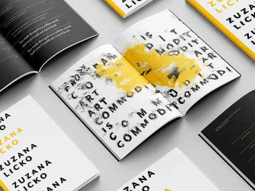 Zuzana Licko type specimen magazine with abstract black text and yellow paint streaks, surrounded by other magazines on a light gray surface.